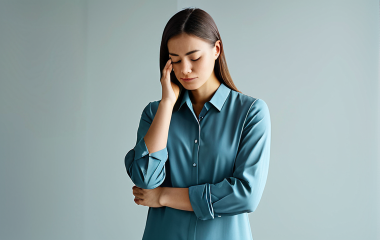 A serene person, standing contemplatively in a softly lit, minimalist studio. Dressed in comfortable, modest, and professional attire. One hand gently touching their temple, suggesting deep thought. The background features subtle, abstract, flowing lines or shapes in calming colors, symbolizing the complexity of inner emotions and thoughts being brought into awareness. The mood is calm, insightful, and hopeful. Professional studio photography, soft focus, high resolution, fully clothed, modest clothing, appropriate attire, professional dress, safe for work, appropriate content, family-friendly, perfect anatomy, correct proportions, natural pose, well-formed hands, proper finger count, natural body proportions.
